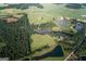 Aerial view of property with two ponds, wooded areas, and solar panels at 1530 Highway 11, Mansfield, GA 30055