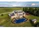 Aerial view showcasing home, pool, and surrounding landscape at 1530 Highway 11, Mansfield, GA 30055