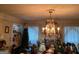 Formal dining room featuring a crystal chandelier and hardwood floors at 1530 Highway 11, Mansfield, GA 30055