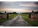 Grand entrance with stone pillars and long driveway at 1530 Highway 11, Mansfield, GA 30055