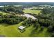 Aerial view of property showing expansive land, pond, and barn at 1530 Highway 11, Mansfield, GA 30055