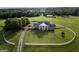 Aerial view of house on large lot with circular driveway and white fence at 1530 Highway 11, Mansfield, GA 30055