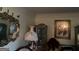 Living room with ornate mirror, antique furniture, and portraits at 1530 Highway 11, Mansfield, GA 30055