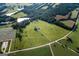 Aerial view of property showing house, land, and pond at 1530 Highway 11, Mansfield, GA 30055