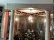 Elegant bathroom with columns, chandelier, and mirrored walls at 1530 Highway 11, Mansfield, GA 30055