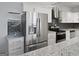 Stainless steel appliances and granite countertops highlight this modern kitchen at 3060 Nw Pharr Cts # 317, Atlanta, GA 30305