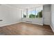 Spacious living room with wood-look floors and large windows at 3060 Nw Pharr Cts # 317, Atlanta, GA 30305