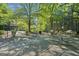 Community patio with tables, chairs and grills at 3060 Nw Pharr Cts # 317, Atlanta, GA 30305