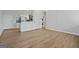 Open living space with wood-look floors and kitchen views at 3060 Nw Pharr Cts # 317, Atlanta, GA 30305