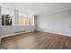 Living room features wood-look floors and abundant natural light at 3060 Nw Pharr Cts # 317, Atlanta, GA 30305