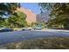 Brick building exterior with ample parking at 3060 Nw Pharr Cts # 317, Atlanta, GA 30305