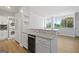 Modern kitchen features granite countertops, stainless steel appliances, and a wine cooler at 3060 Nw Pharr Cts # 317, Atlanta, GA 30305