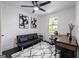 Home office features a black futon, a wood desk, and a patterned rug at 2161 Penelope Nw St, Atlanta, GA 30314