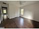 Bedroom with hardwood floor, door to hallway and window at 166 Greentree Trl, Temple, GA 30179