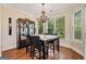 Bright dining room boasts a marble-top table and a large chandelier at 2121 Whitekirk Nw St, Kennesaw, GA 30152