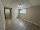 Spacious finished basement bedroom with laminate flooring and an additional room at 1863 Rollingwood Se Dr, Atlanta, GA 30316