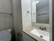 Bathroom with granite vanity and updated fixtures at 1863 Rollingwood Se Dr, Atlanta, GA 30316