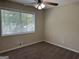 Bedroom with ceiling fan, window blinds and carpet at 1863 Rollingwood Se Dr, Atlanta, GA 30316
