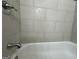 Clean bathroom with a shower and tile surround at 1863 Rollingwood Se Dr, Atlanta, GA 30316