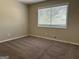 Well-lit bedroom, featuring neutral walls and carpet at 1863 Rollingwood Se Dr, Atlanta, GA 30316