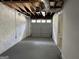 Finished basement garage with painted concrete floor and access to other areas at 1863 Rollingwood Se Dr, Atlanta, GA 30316
