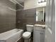 Updated bathroom with bathtub and stylish tile at 1863 Rollingwood Se Dr, Atlanta, GA 30316