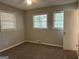 Bright bedroom with neutral walls and carpet flooring at 2360 Green Forrest Dr, Decatur, GA 30032