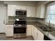 Kitchen features granite countertops and stainless steel appliances at 2360 Green Forrest Dr, Decatur, GA 30032