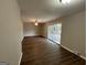 Spacious living area with dark hardwood floors and sliding glass doors at 2360 Green Forrest Dr, Decatur, GA 30032