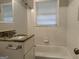 Clean bathroom with granite vanity and updated fixtures at 2360 Green Forrest Dr, Decatur, GA 30032