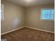 Spacious carpeted bedroom with neutral walls and two windows at 2360 Green Forrest Dr, Decatur, GA 30032