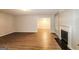 Bright living room featuring hardwood floors and a fireplace at 3796 Wolverton Cir, Lithonia, GA 30038