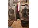Bright laundry room, featuring a washer and dryer, and ample shelving at 1158 Folkstone Dr, Mcdonough, GA 30253
