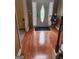 Hardwood floors and a charming entry door with glass accents at 1158 Folkstone Dr, Mcdonough, GA 30253