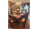 Formal dining room with a large table and chandelier at 1158 Folkstone Dr, Mcdonough, GA 30253