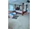 Spacious main bedroom with a large four-poster bed and plenty of natural light at 1158 Folkstone Dr, Mcdonough, GA 30253