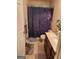 Clean bathroom with a shower/tub combo and wood vanity at 1158 Folkstone Dr, Mcdonough, GA 30253