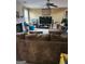 Gathering room with sectional sofa and large TV at 1158 Folkstone Dr, Mcdonough, GA 30253