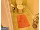 Small bathroom with toilet, and floor rug at 1158 Folkstone Dr, Mcdonough, GA 30253