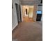 Spacious upper hallway with carpet flooring, leading to bedrooms and staircase at 1158 Folkstone Dr, Mcdonough, GA 30253