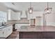 Modern kitchen featuring white cabinets and granite countertops at 585 Highway 155 North N, Mcdonough, GA 30252