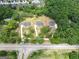 Aerial view of three homes nestled in a wooded area at 585 Highway 155 North N, Mcdonough, GA 30252