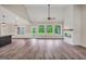 Spacious living room featuring hardwood floors, a fireplace, and large windows at 585 Highway 155 North N, Mcdonough, GA 30252