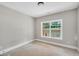 Bright bedroom with carpet and large window at 585 Highway 155 North N, Mcdonough, GA 30252