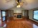 Spacious living room with hardwood floors and a brick fireplace at 1381 Durden Rd, Rutledge, GA 30663