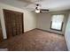 Spacious bedroom with ceiling fan and carpet flooring at 1381 Durden Rd, Rutledge, GA 30663