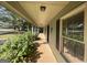 Inviting front porch with wooden railings and landscaping at 1381 Durden Rd, Rutledge, GA 30663