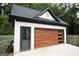 Detached garage with modern wood and glass garage door at 3299 Sims St, Hapeville, GA 30354