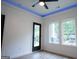 Bright bedroom with three windows, door to deck, and wood floors at 3299 Sims St, Hapeville, GA 30354