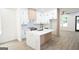 Modern kitchen with white cabinets, quartz countertops, and large island at 3299 Sims St, Hapeville, GA 30354